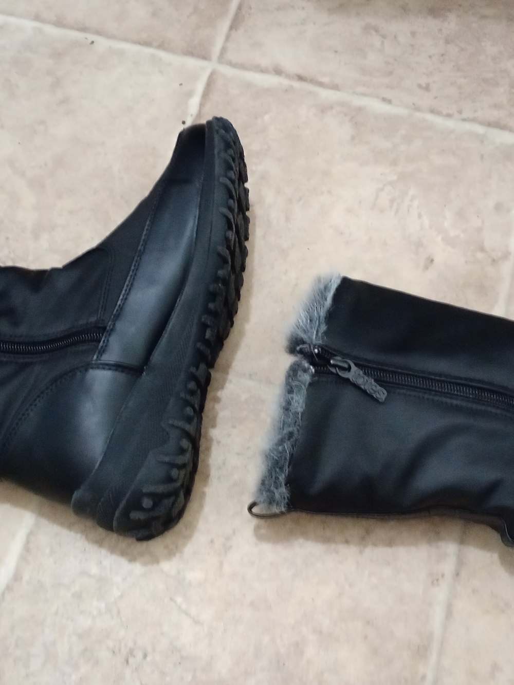Black Alicia  side-zip boots feature distinctive gray faux fur lining size 8M